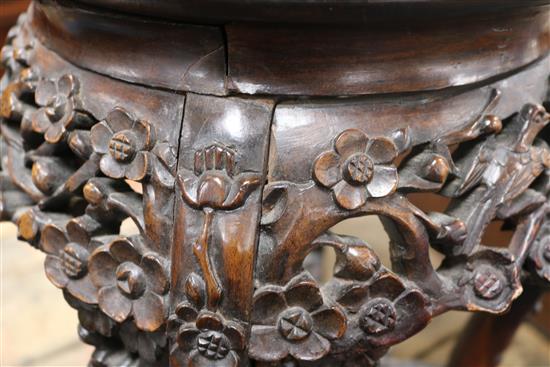 A pair of 19th century Chinese carved hardwood jardiniere stands